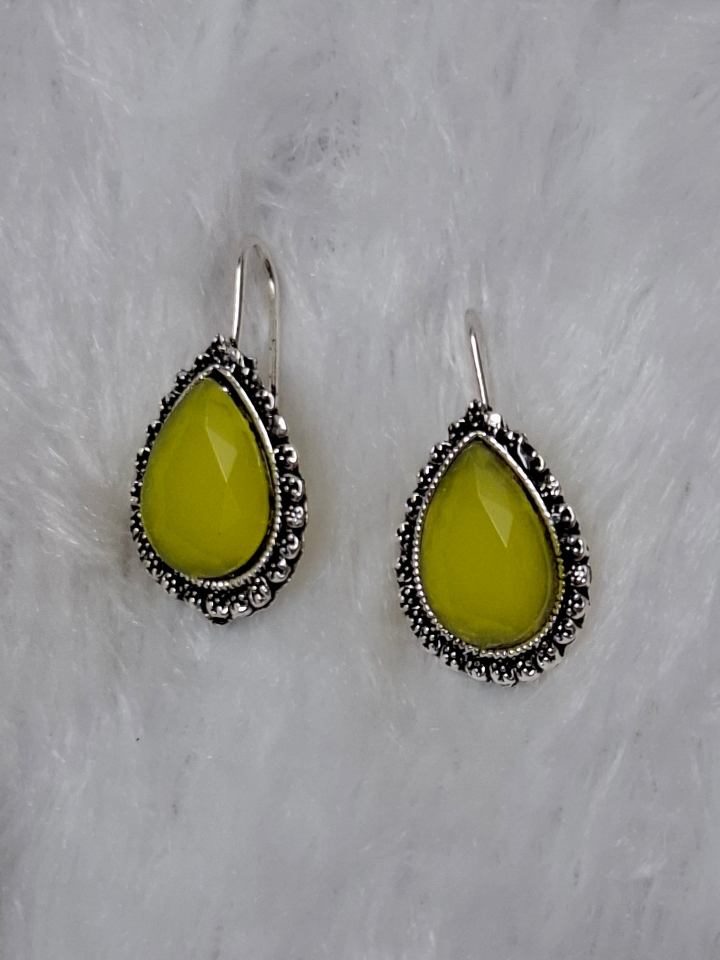 Silver tone earrings Yellow