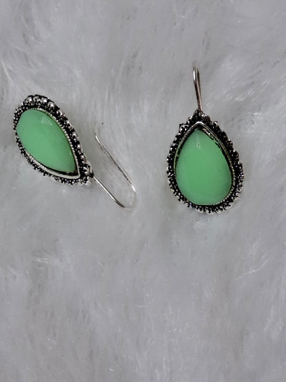 Silver tone earrings Green